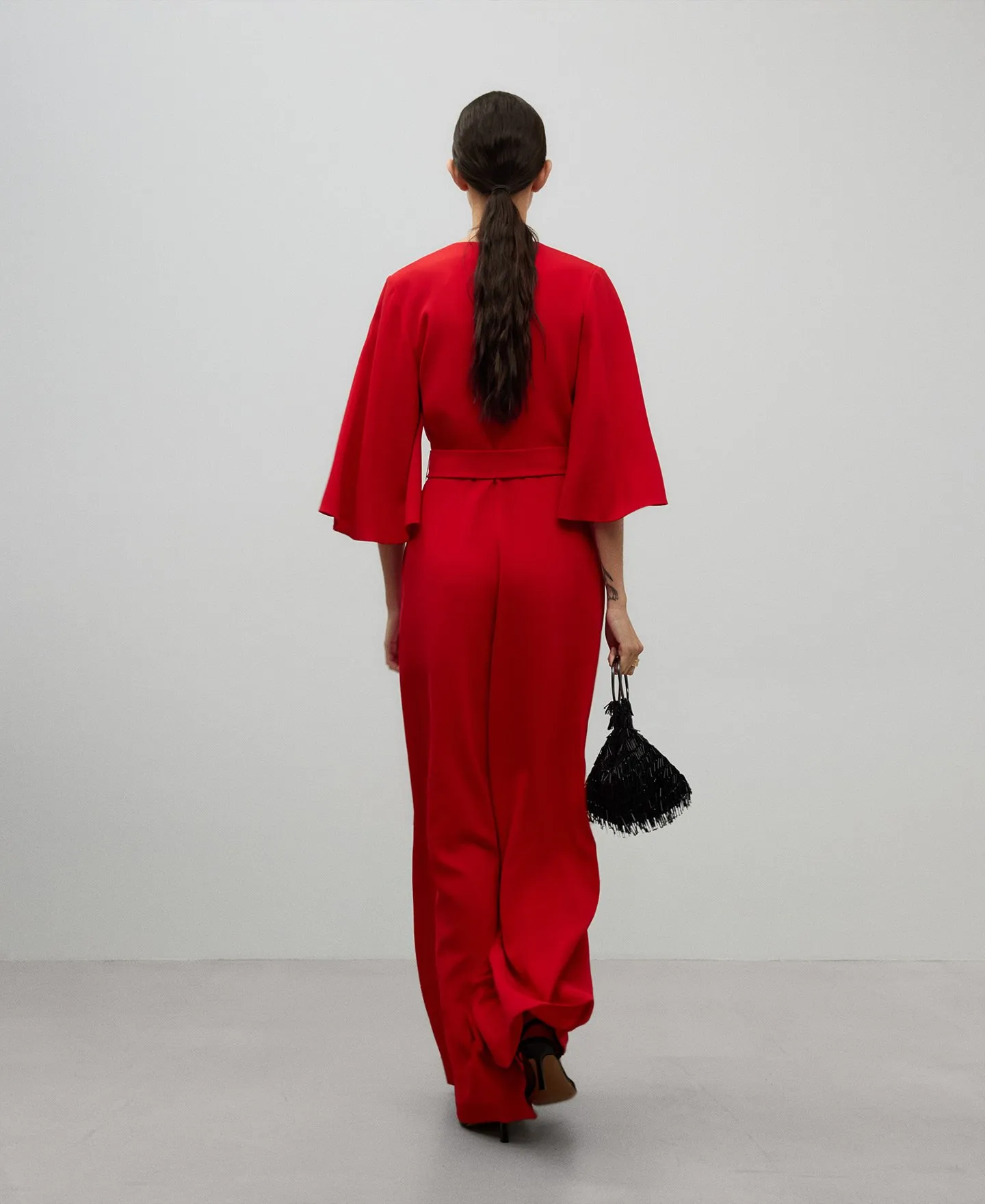 Long red jumpsuit woman